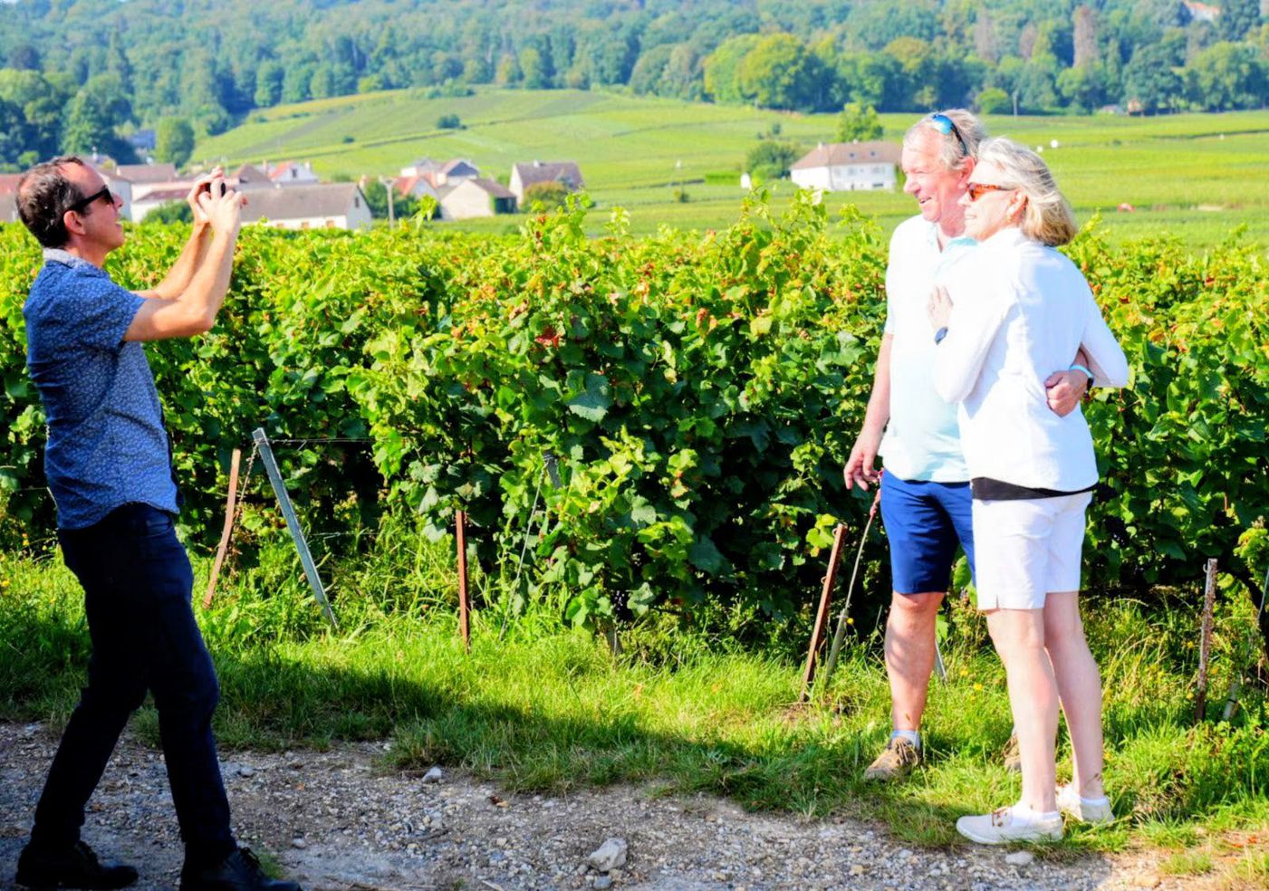Tourists visit a vineyard with a guide